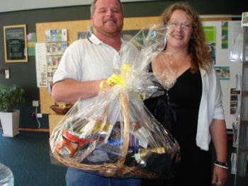 Shane receives a gift box from Claire after a Christmas draw